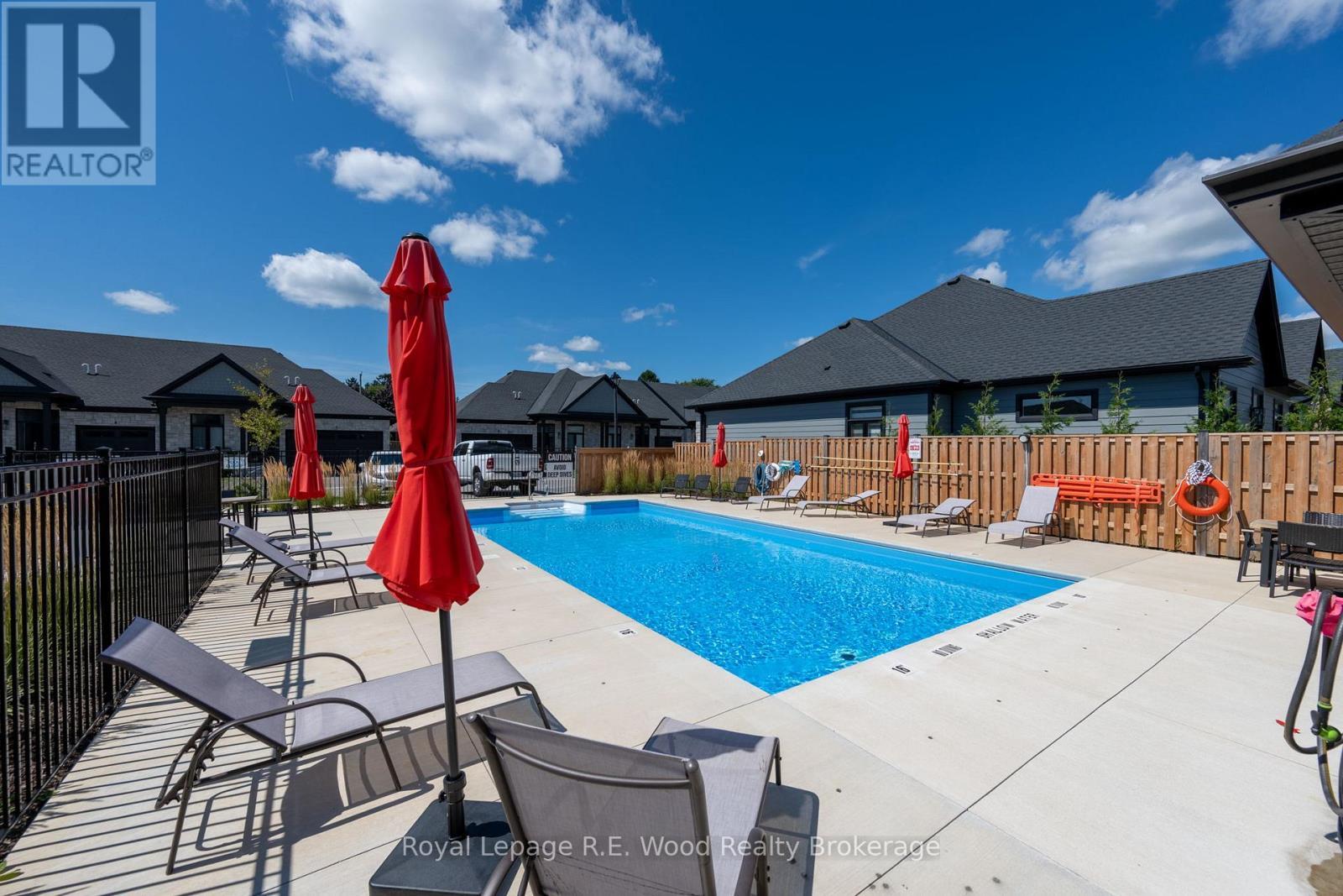 32 - 63 Compass Trail, Central Elgin, ON - Outdoor With In Ground Pool With Deck Patio Veranda