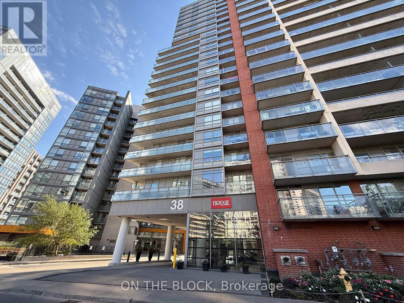302 - 38 Joe Shuster Way, Toronto, ON - Outdoor With Balcony With Facade