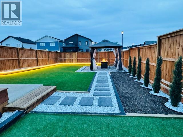 212 Neecheah Street, Whitehorse, YT - Outdoor With Backyard