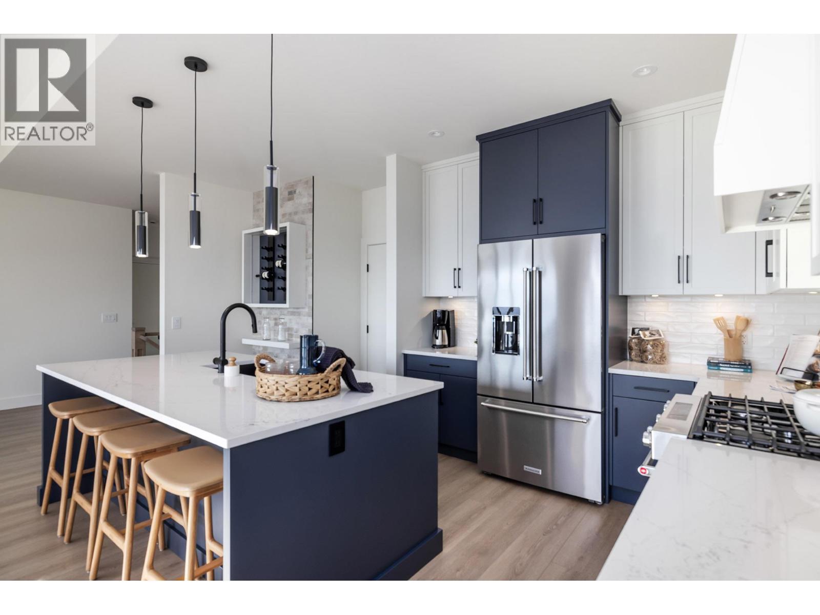 **Showhome photos - Actual home may differ in design, finishes, and features** - 4075 Sunstone Street, West Kelowna, BC - Indoor Photo Showing Kitchen With Upgraded Kitchen