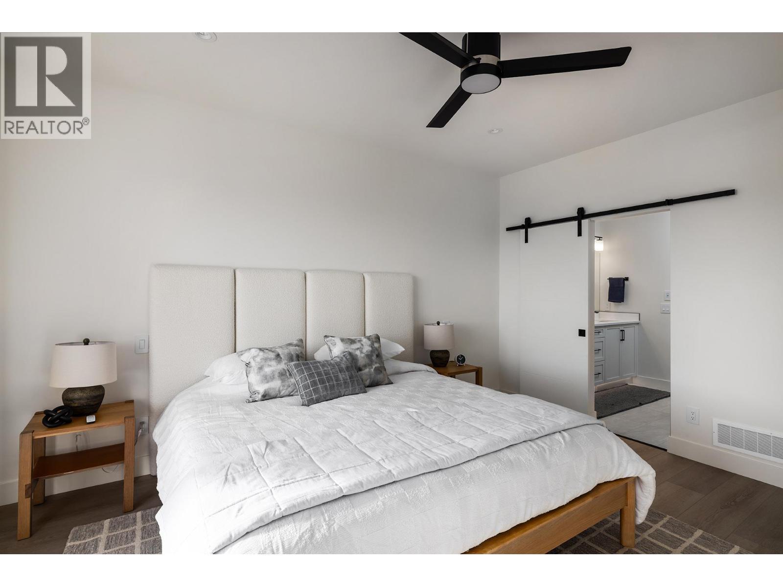 **Showhome photos - Actual home may differ in design, finishes, and features** - 4075 Sunstone Street, West Kelowna, BC - Indoor Photo Showing Bedroom