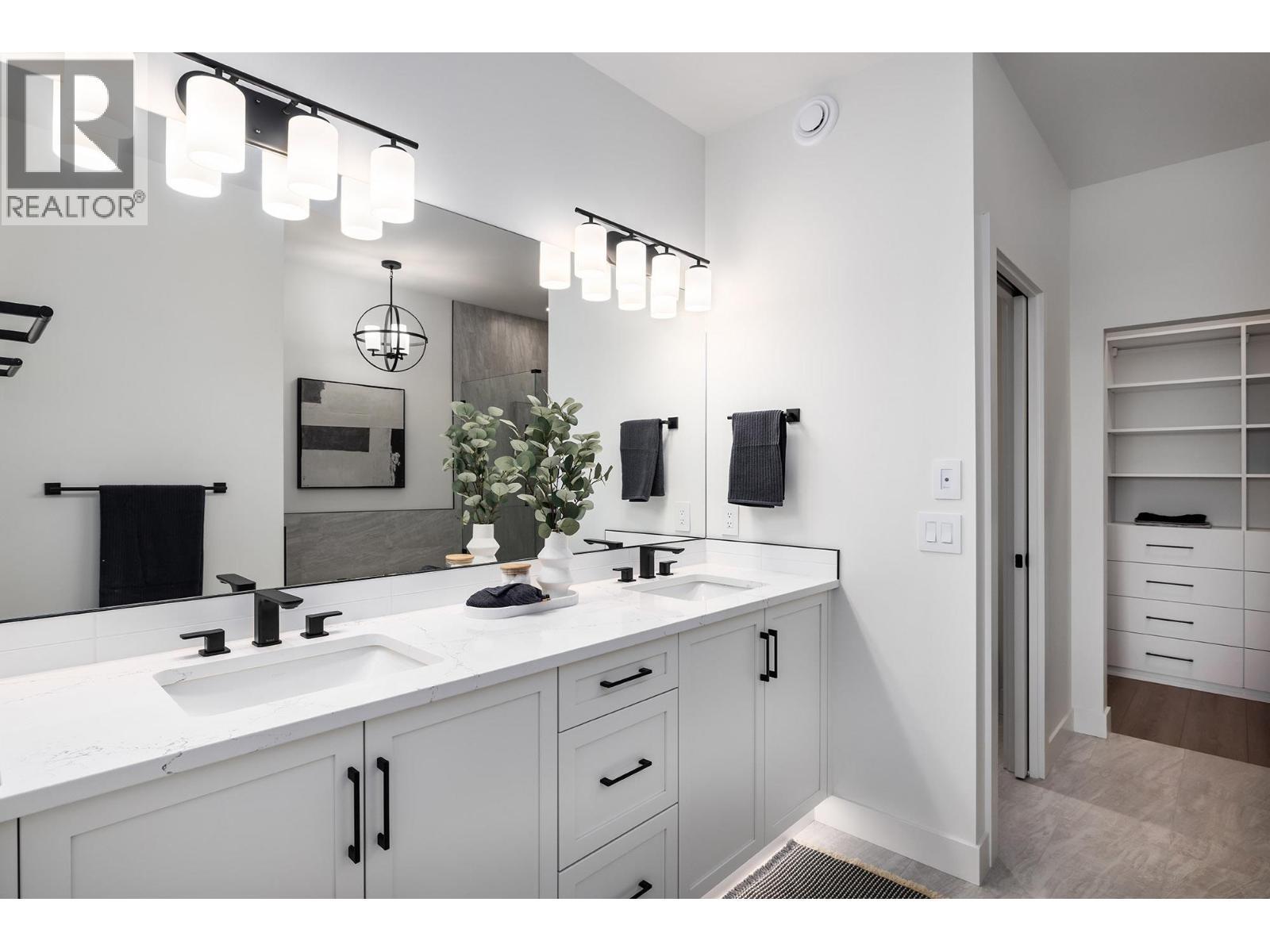 **Showhome photos - Actual home may differ in design, finishes, and features** - 4075 Sunstone Street, West Kelowna, BC - Indoor Photo Showing Bathroom