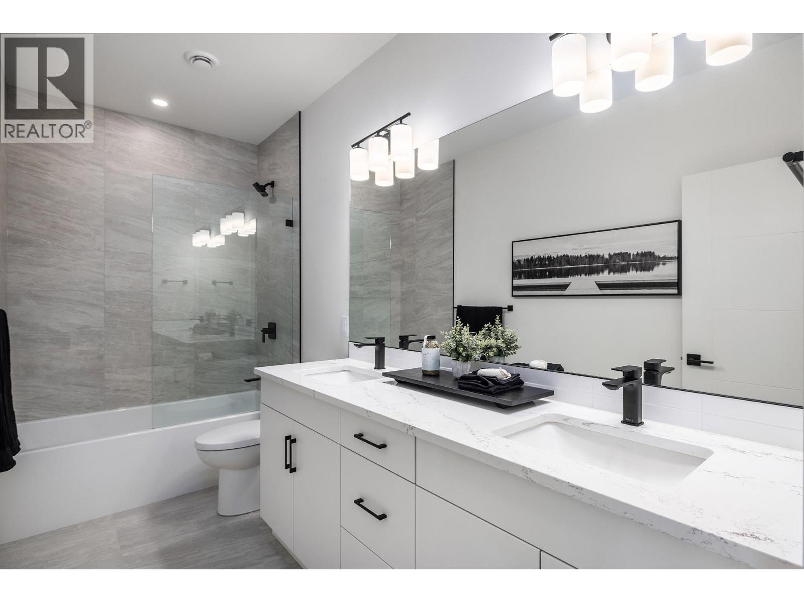 **Showhome photos - Actual home may differ in design, finishes, and features** - 4075 Sunstone Street, West Kelowna, BC - Indoor Photo Showing Bathroom