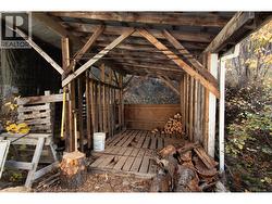 Wood shed by house -