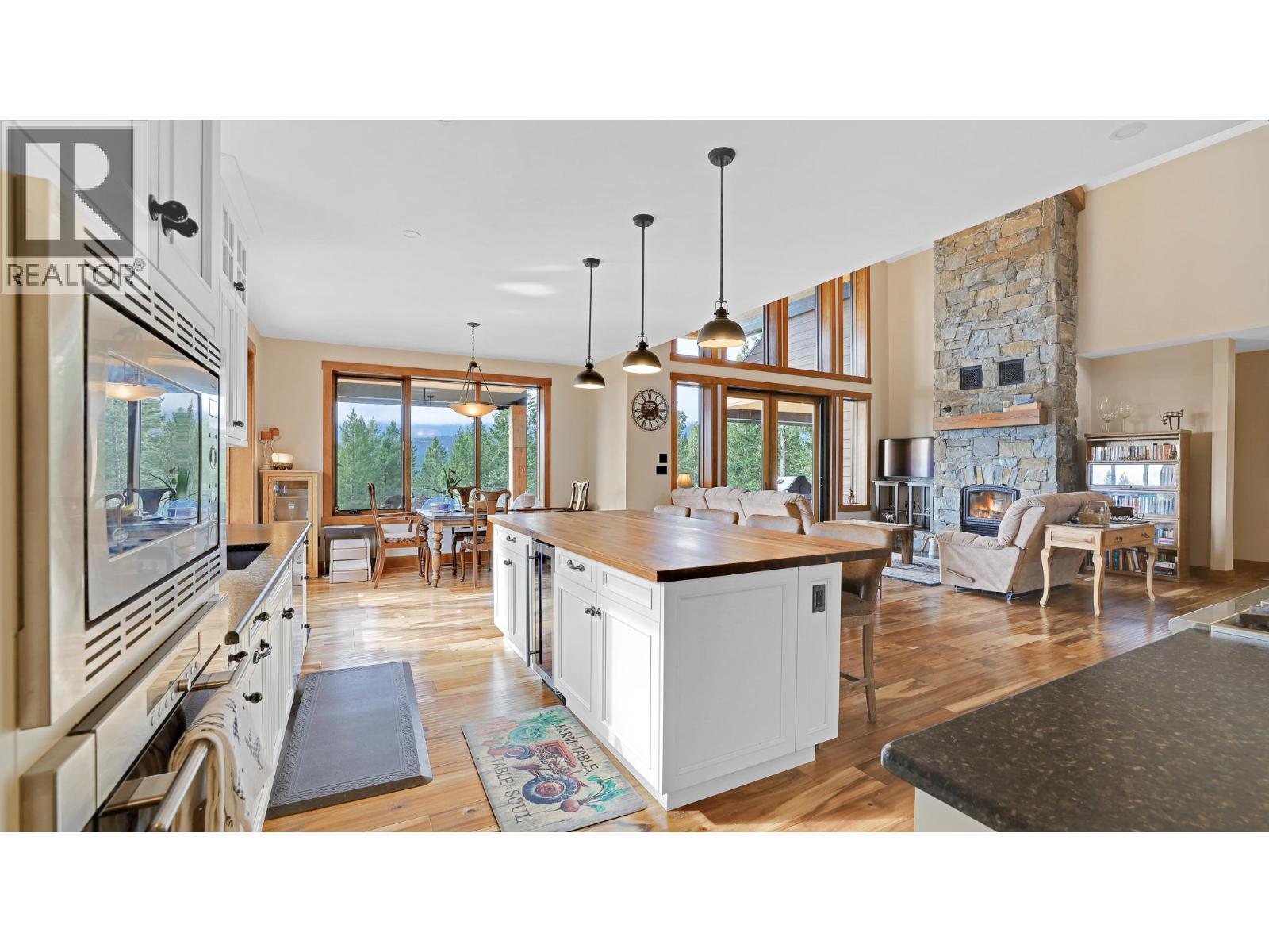 2621 Brewer Ridge Rise, Invermere, BC - Indoor Photo Showing Kitchen With Fireplace
