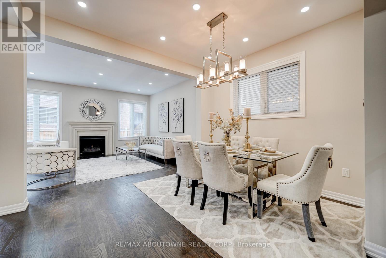 385 Dahlia Trail, Oakville, ON - Indoor Photo Showing Dining Room With Fireplace