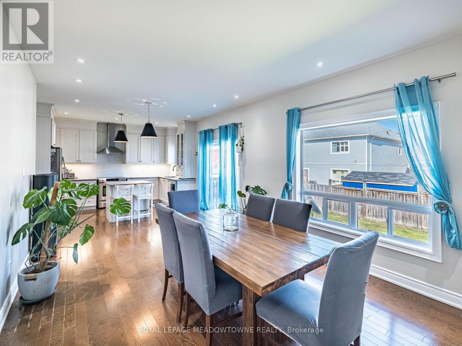 Dining area open to kitchen with walkout to yard - 543 Wansbrough Way, Shelburne, ON - Indoor Photo Showing Dining Room