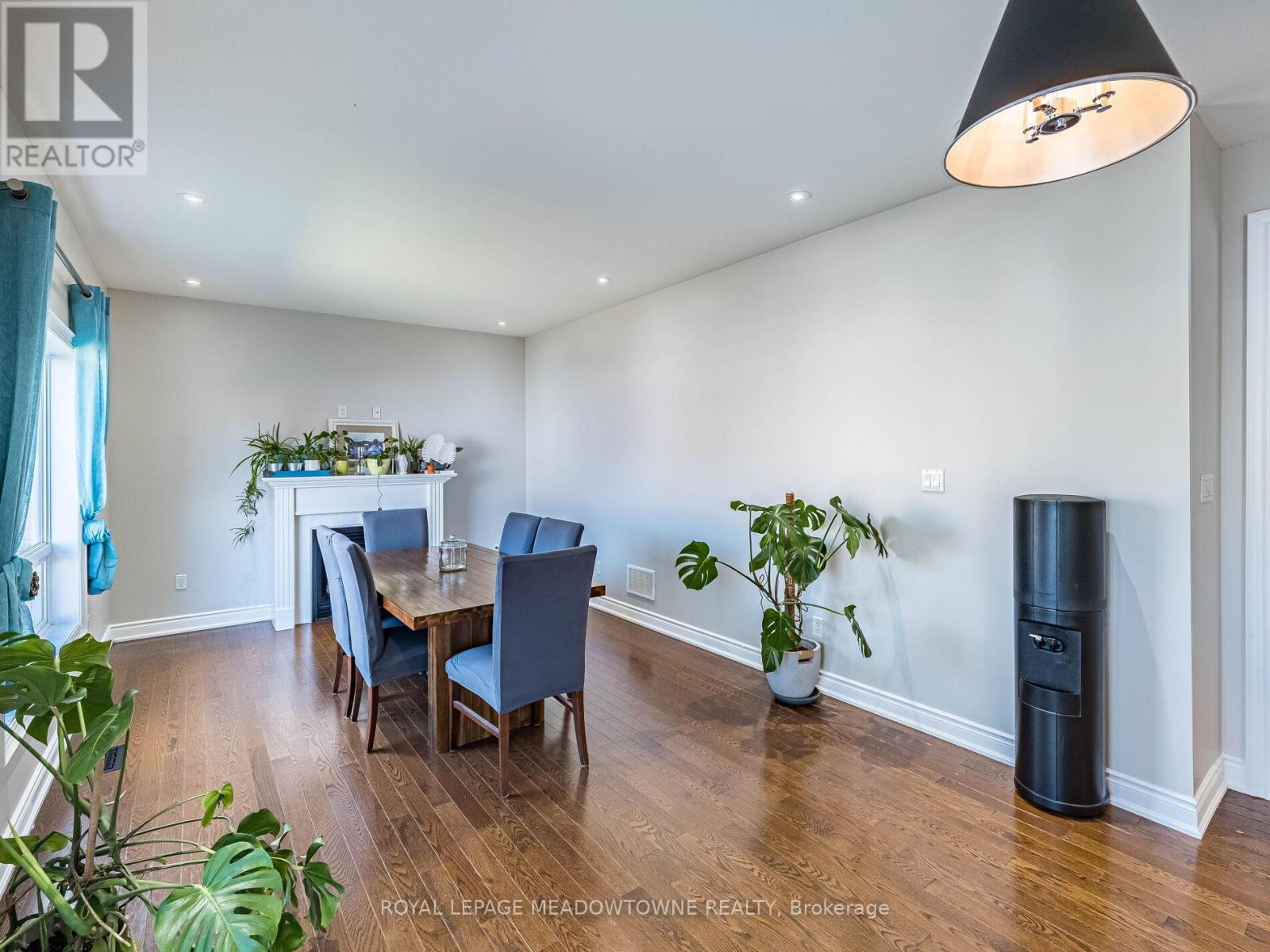 Formal dining room with fireplace - 543 Wansbrough Way, Shelburne, ON - Indoor Photo Showing Dining Room