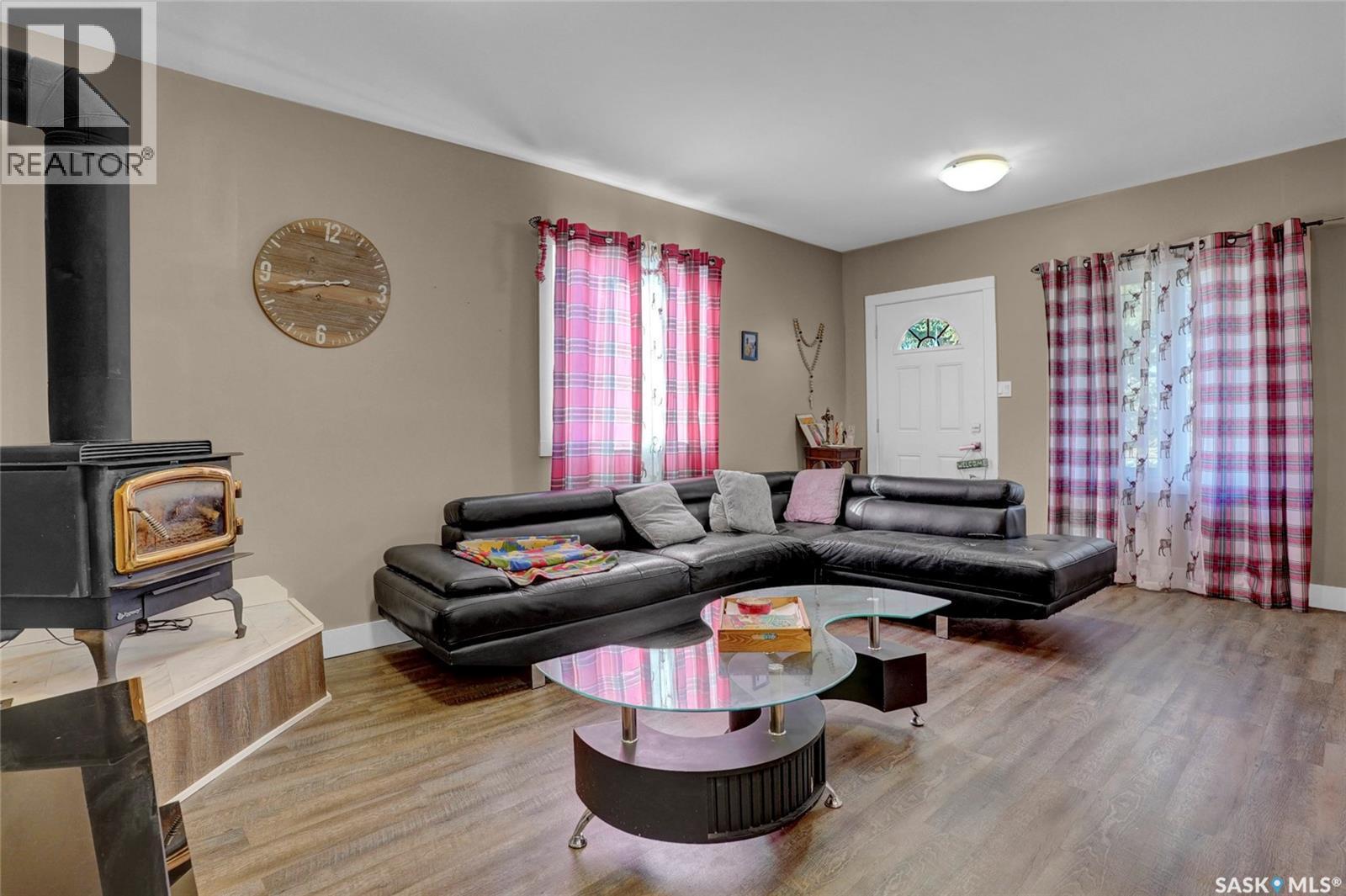 26 Main Street, Marquis, SK - Indoor Photo Showing Living Room With Fireplace