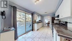 Kitchen with sliding doors to a cedar deck -