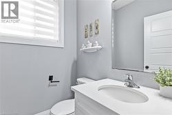 Half bath with vanity and toilet -