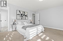 Bedroom with light colored carpet -