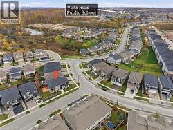 Aerial view of property's location with nearby suburban area -