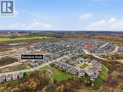 Aerial view of property's location with nearby suburban area -