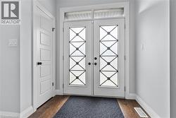 Entryway with wood finished floors and french doors -