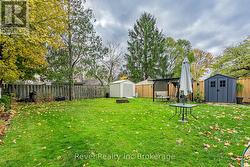 Mature trees and a large fenced in yard. -