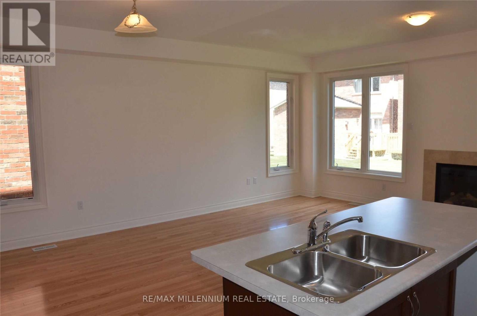 50 Andretti Crescent, Brampton, ON - Indoor Photo Showing Kitchen With Fireplace With Double Sink
