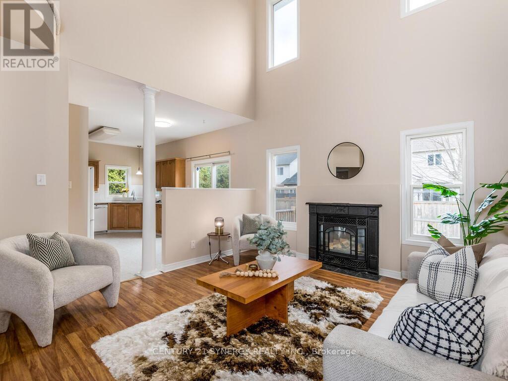 Located right beside the kitchen! - 34 Eliza Crescent, Ottawa, ON - Indoor Photo Showing Living Room With Fireplace