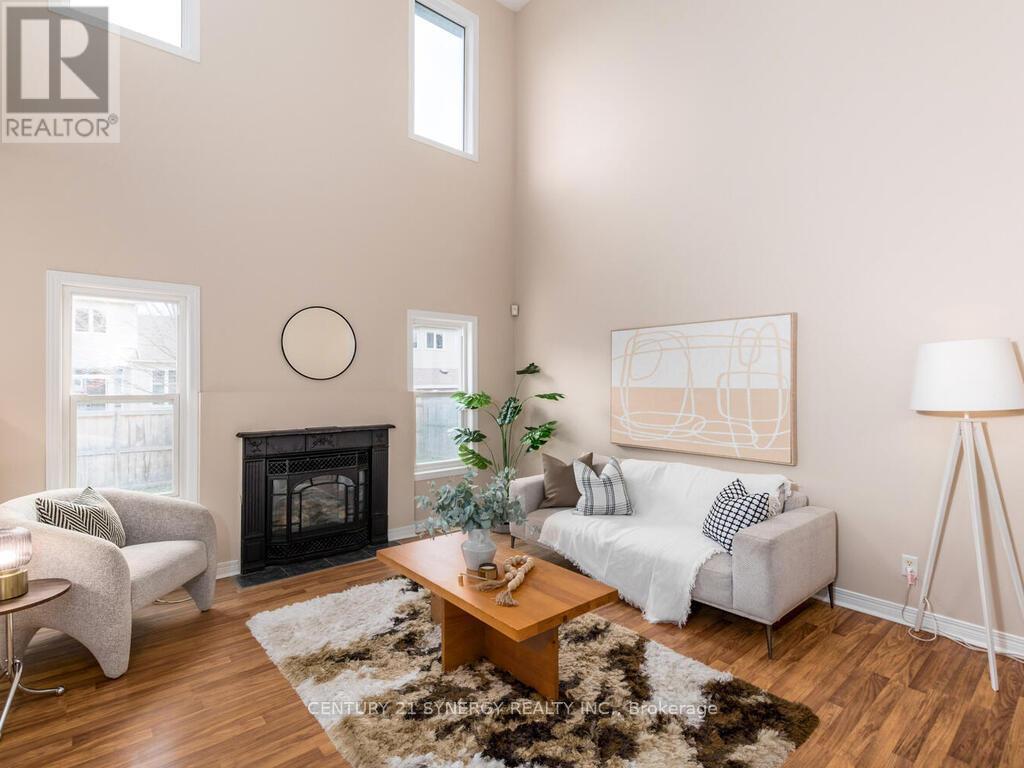Main floor family room features 20 foot ceilings.. - 34 Eliza Crescent, Ottawa, ON - Indoor Photo Showing Living Room With Fireplace