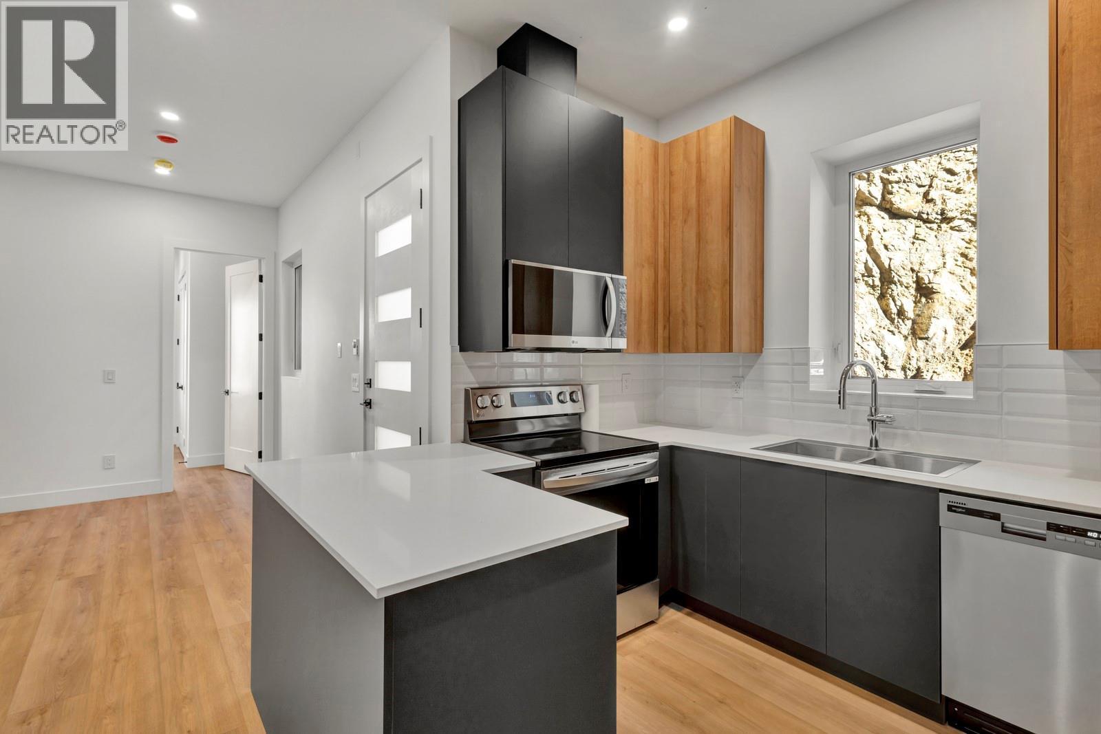 Suite kitchen - 1122 Pearcy Court, Kelowna, BC - Indoor Photo Showing Kitchen With Double Sink