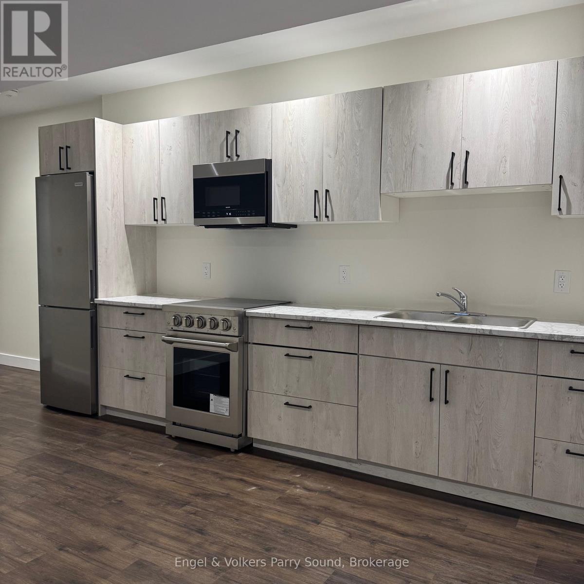 101 - 57 James Street, Parry Sound, ON - Indoor Photo Showing Kitchen With Double Sink