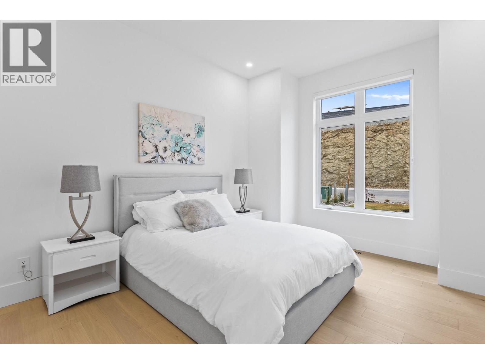 Main floor bdrm - 1359 Vineyard Drive, West Kelowna, BC - Indoor Photo Showing Bedroom