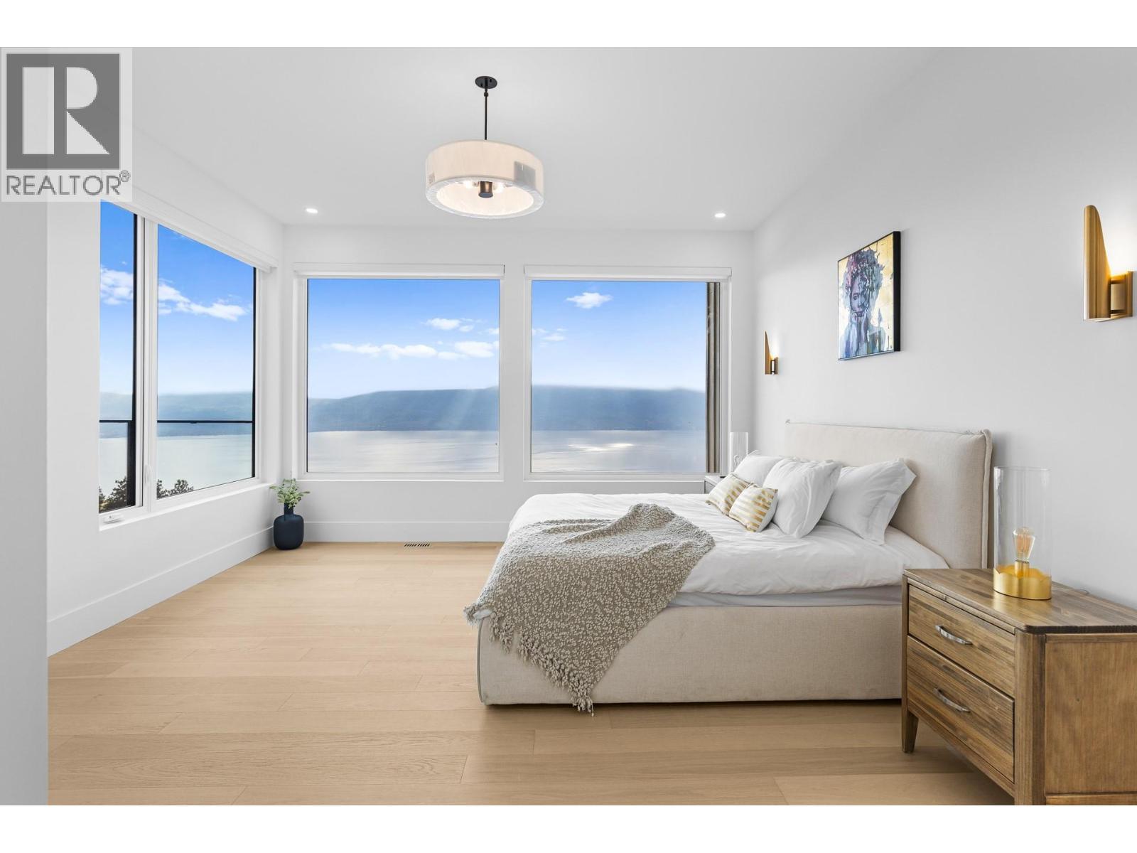 Main flr primary bdrm - 1359 Vineyard Drive, West Kelowna, BC - Indoor Photo Showing Bedroom