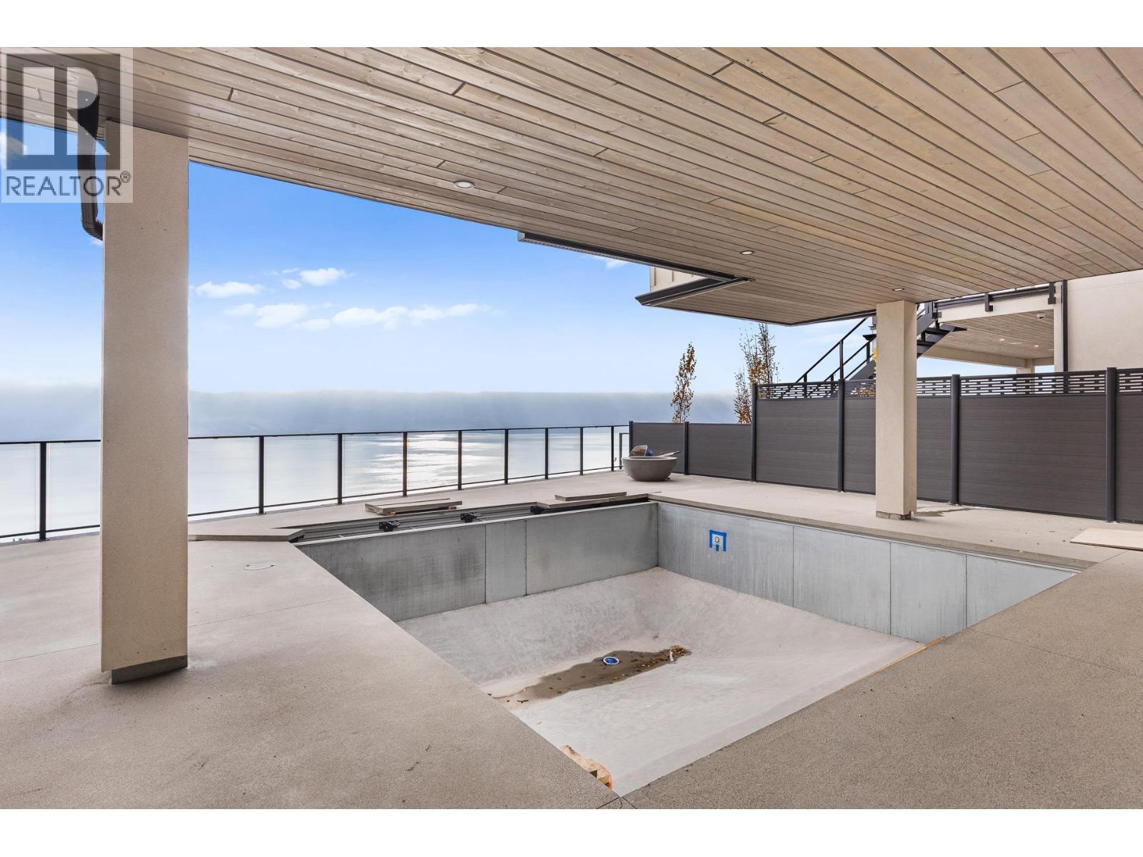 Covered pool with waterfall - 1359 Vineyard Drive, West Kelowna, BC - Outdoor With Exterior