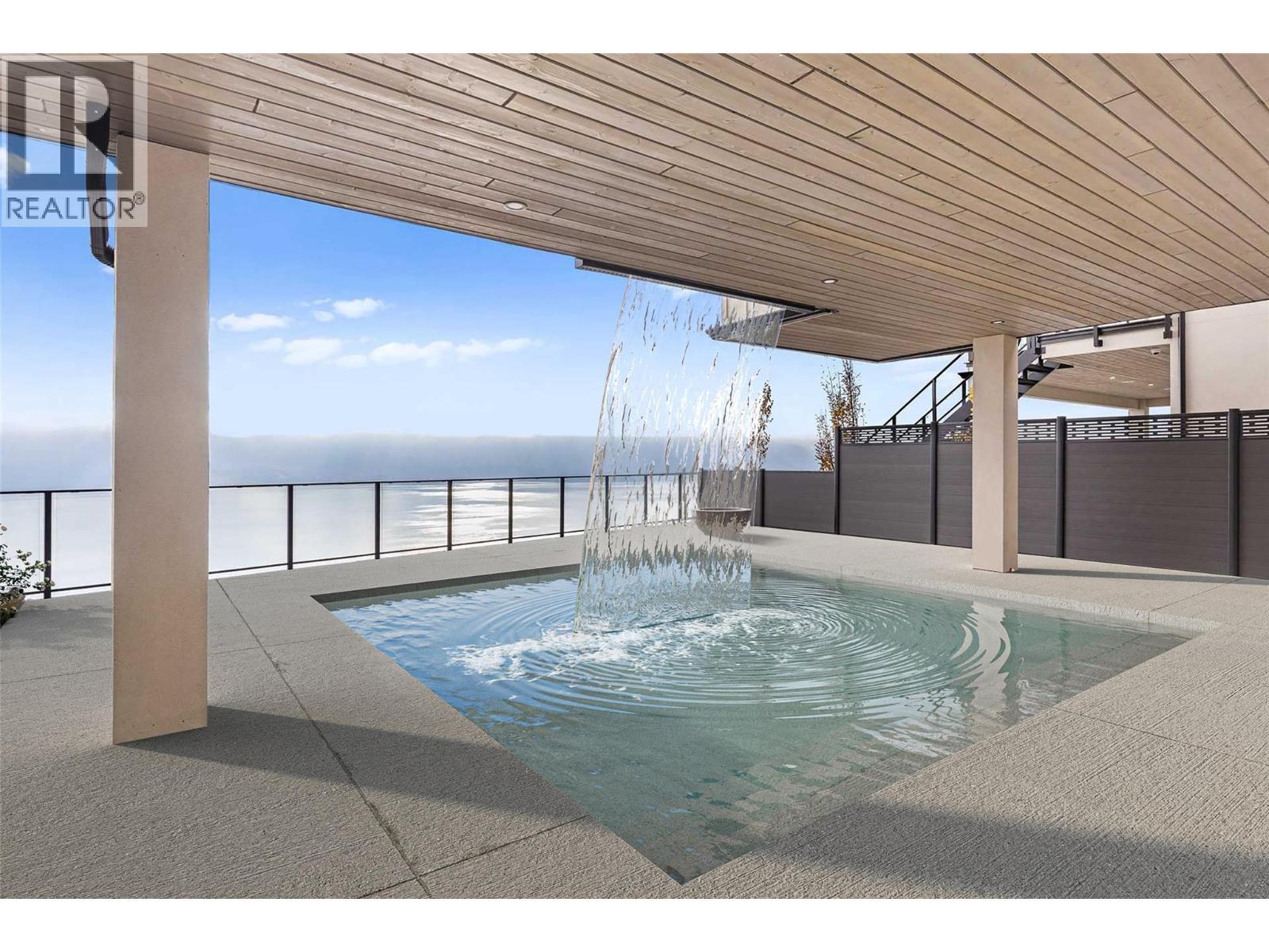 Pool with overhead waterfall - 1359 Vineyard Drive, West Kelowna, BC - Outdoor With In Ground Pool