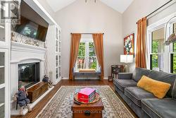 Livingroom, double sided wood burning fireplace. -