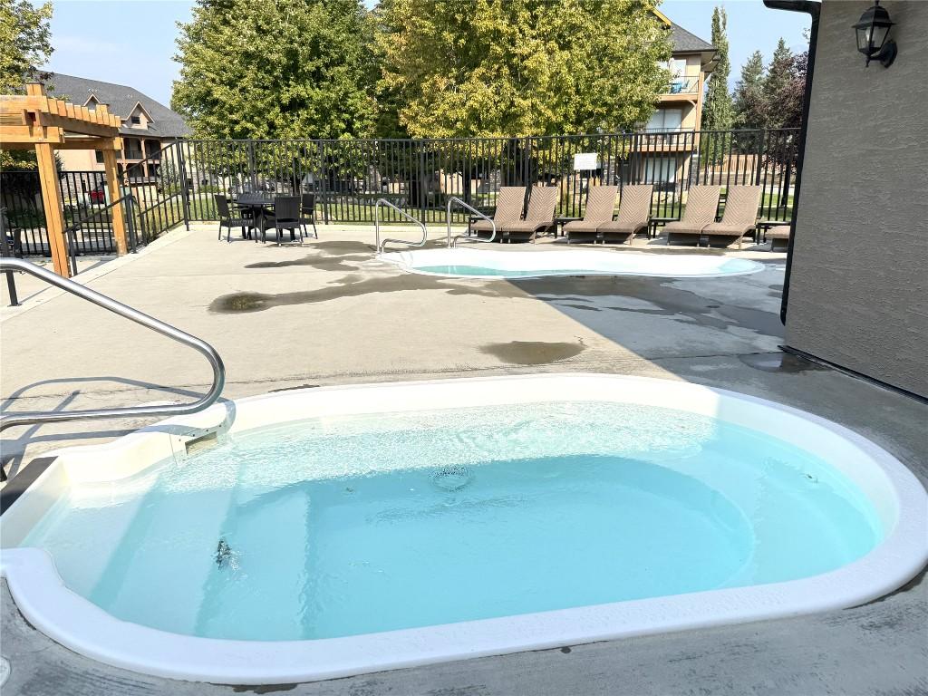 211D-200 Bighorn Boulevard, Radium Hot Springs, BC - Outdoor With In Ground Pool