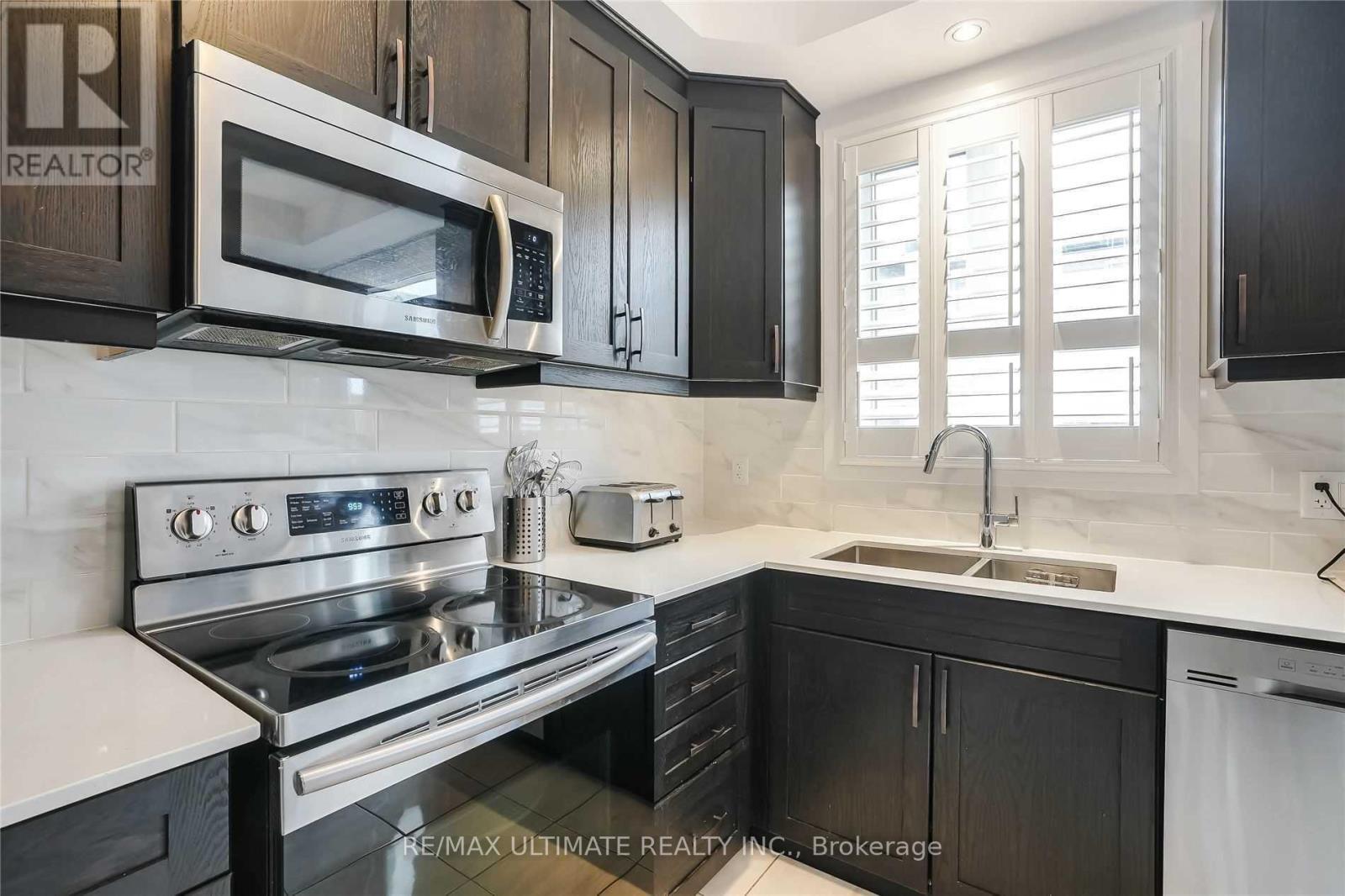 290 - 30 Times Square Boulevard, Hamilton, ON - Indoor Photo Showing Kitchen With Double Sink With Upgraded Kitchen