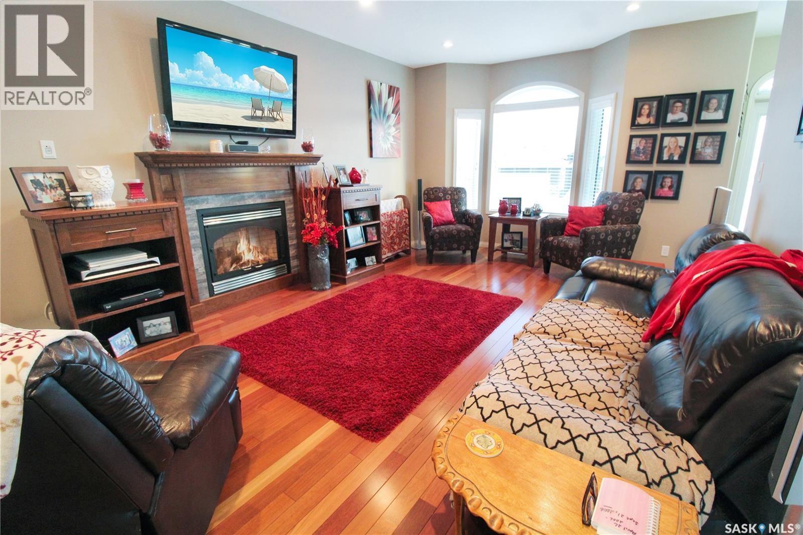 615 Hodgson Drive, Swift Current, SK - Indoor Photo Showing Living Room With Fireplace