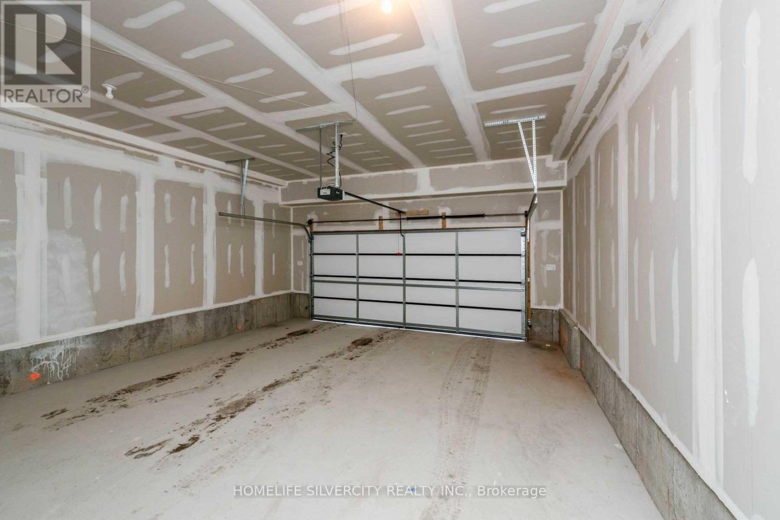 # 2 - 24 Humberwood Boulevard, Toronto, ON - Indoor Photo Showing Garage