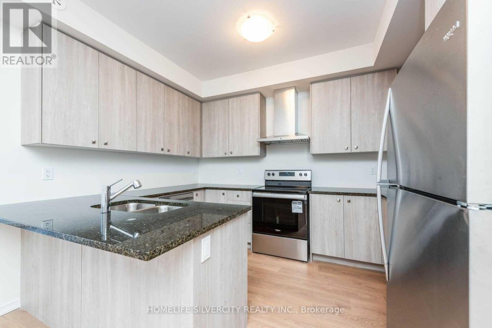 # 2 - 24 Humberwood Boulevard, Toronto, ON - Indoor Photo Showing Kitchen With Double Sink