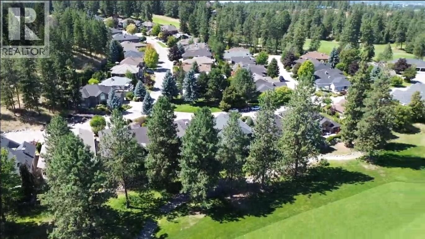 property is in the gap of trees in photo along fairway - 3897 Gallaghers Grange, Kelowna, BC - Outdoor With View