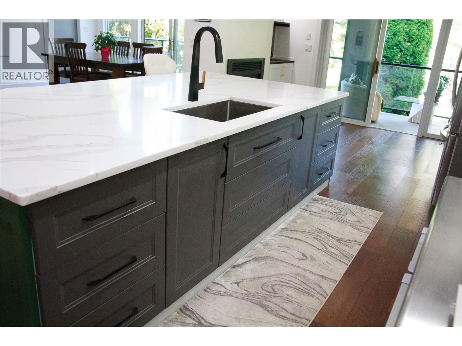 soft close drawers and cabinets along with hidden upper drawer inserts for extra storage - 3897 Gallaghers Grange, Kelowna, BC - Indoor Photo Showing Kitchen