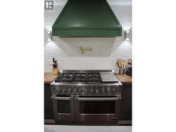 48 inch gas stove with flat top grill, pot filler and large exhaust vent/light -