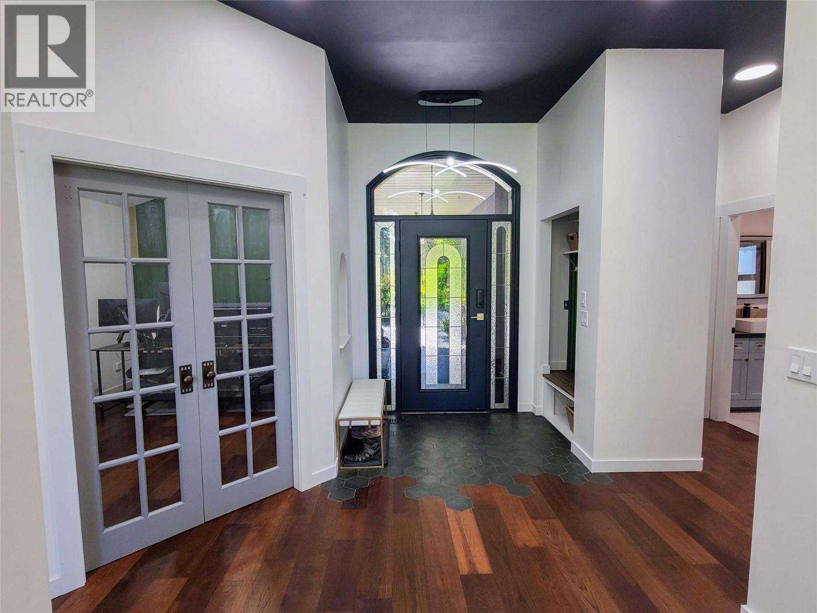 front entrance with office and hallway to guest bed - 3897 Gallaghers Grange, Kelowna, BC - Indoor Photo Showing Other Room