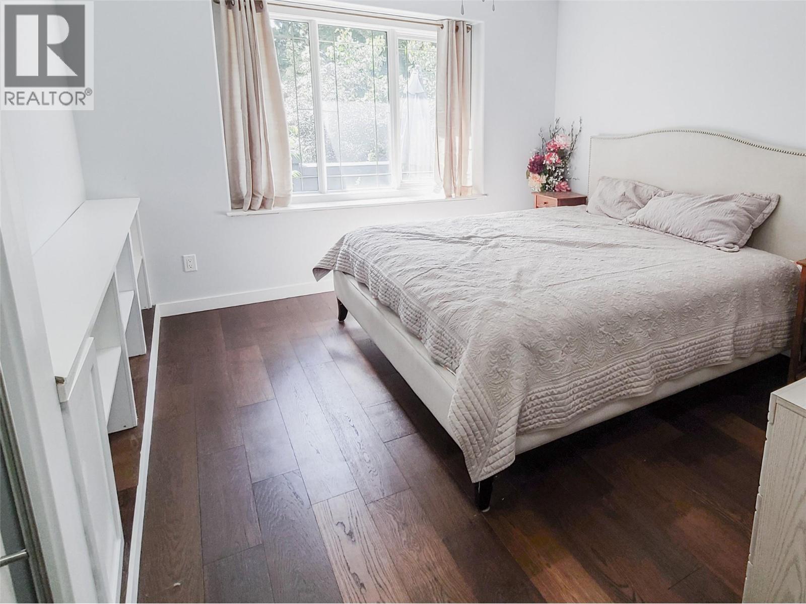 guest bed with custom built in shelving - 3897 Gallaghers Grange, Kelowna, BC - Indoor Photo Showing Bedroom