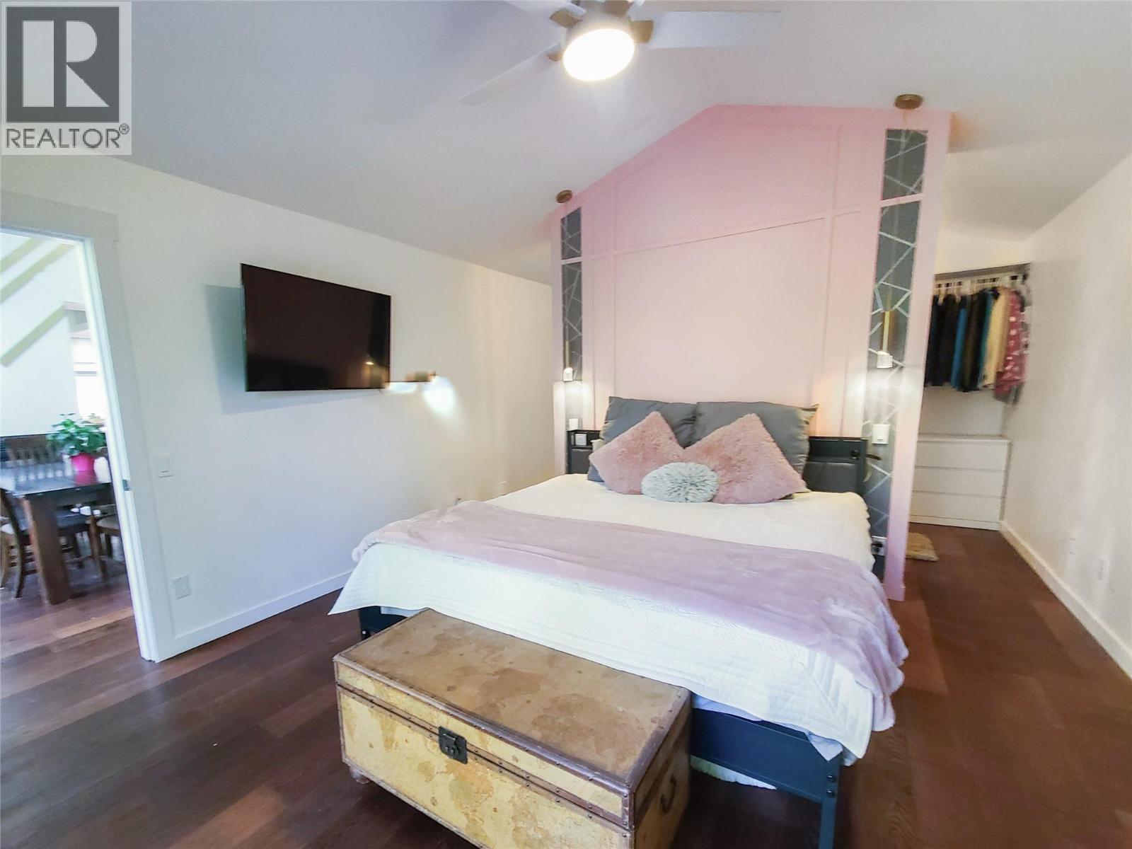 master bed with walk around double entry closet leading to ensuite - 3897 Gallaghers Grange, Kelowna, BC - Indoor Photo Showing Bedroom