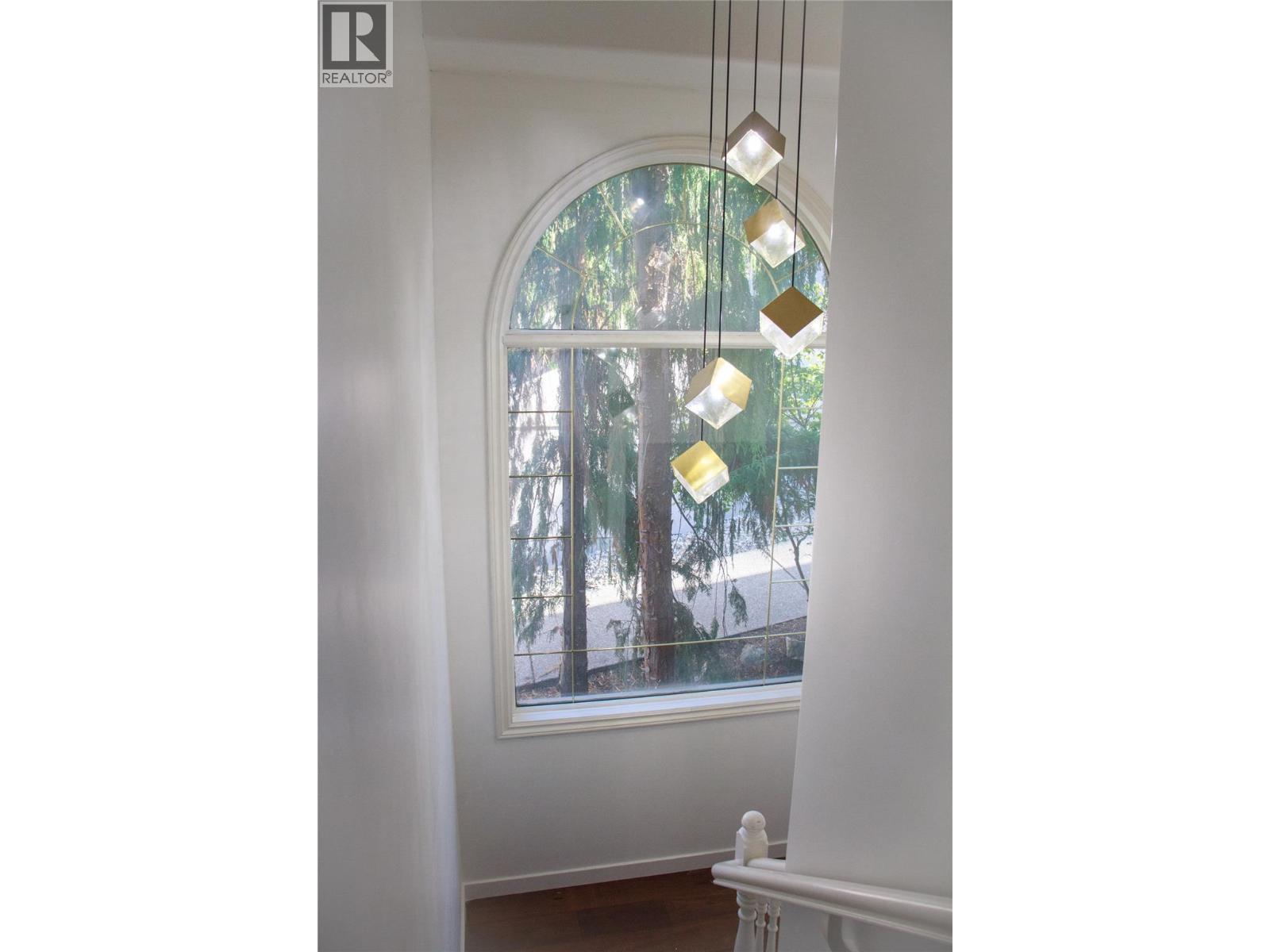 stairwell downstairs - 3897 Gallaghers Grange, Kelowna, BC - Indoor Photo Showing Other Room