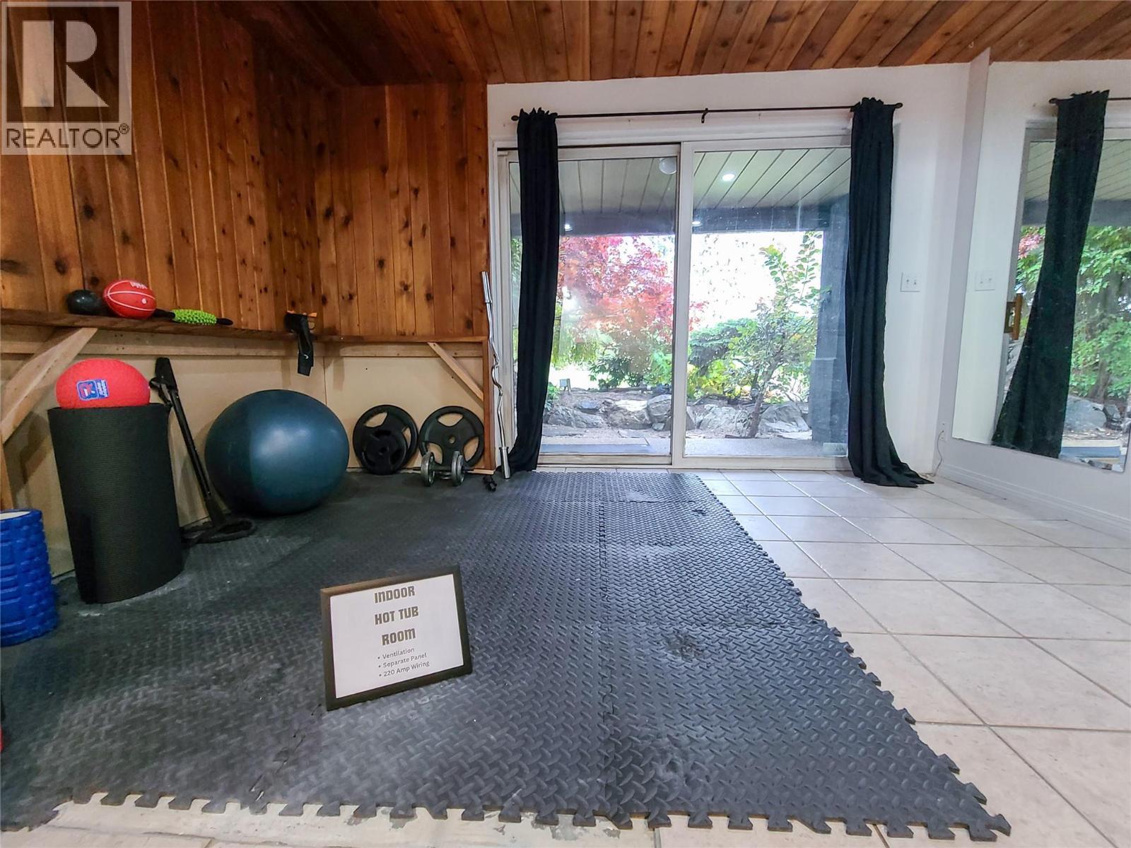 hot tub room has drainage, dedicated plug and amp and ventilation for your hot tub - 3897 Gallaghers Grange, Kelowna, BC - Indoor Photo Showing Other Room