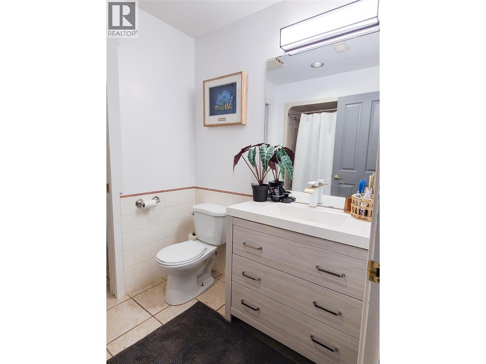 full bathroom with additional shower connected with pocket door, for hot tub area use. - 3897 Gallaghers Grange, Kelowna, BC - Indoor Photo Showing Bathroom
