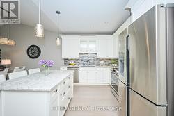 BRIGHT MODERN KITCHEN WITH QUARTZ ISLAND -