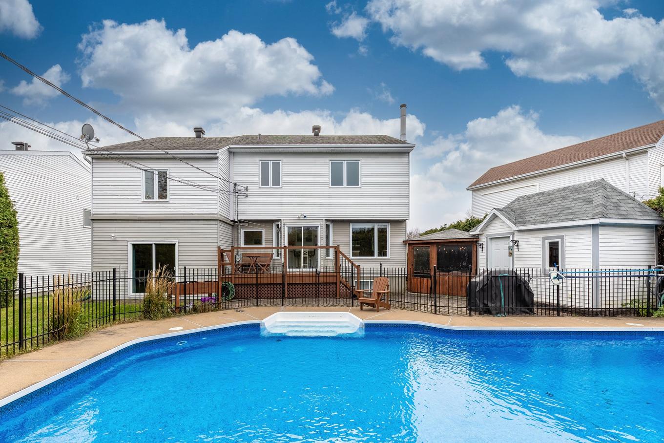 Back facade - 83 Rue Antoine-Quiriac, Saint-Jean-Sur-Richelieu, QC - Outdoor With In Ground Pool With Deck Patio Veranda