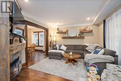 Living room with stone wall and electric fireplace -