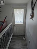 Doorway to outside with wood finished floors -