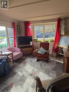 Sitting room with wood laminate finished floors -