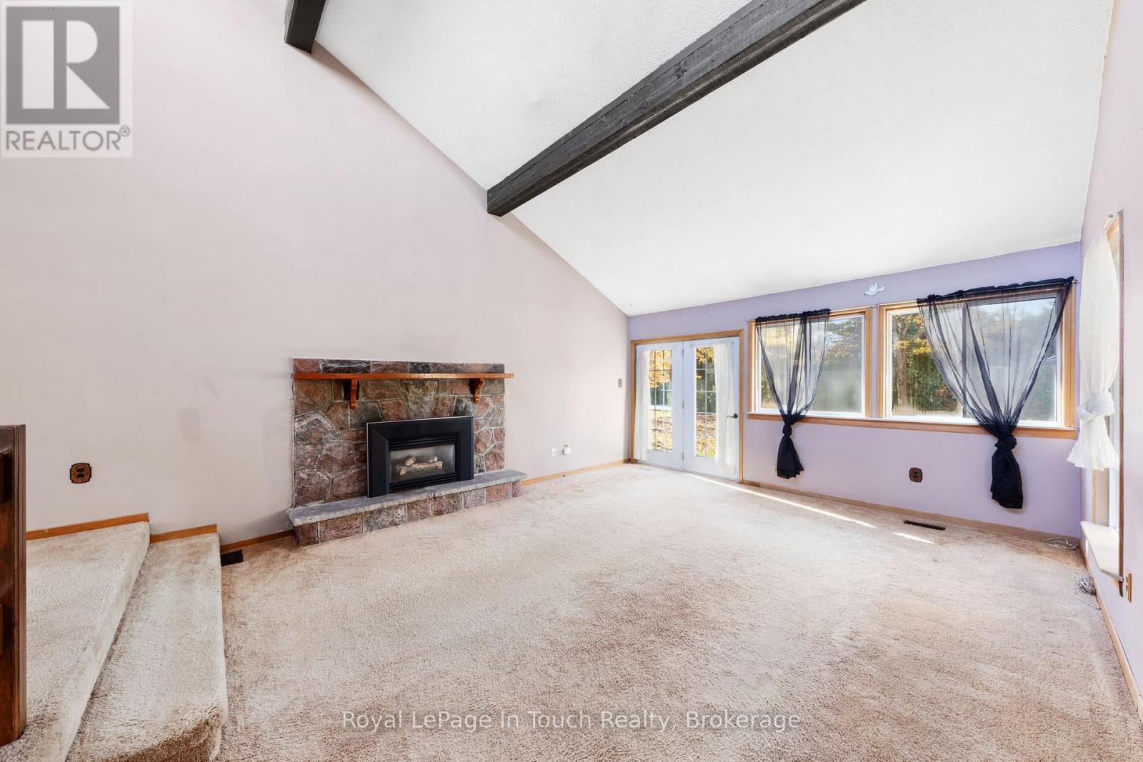 Gas Fireplace and Walkout - 2 Coppercliff Crescent, Tiny, ON - Indoor With Fireplace